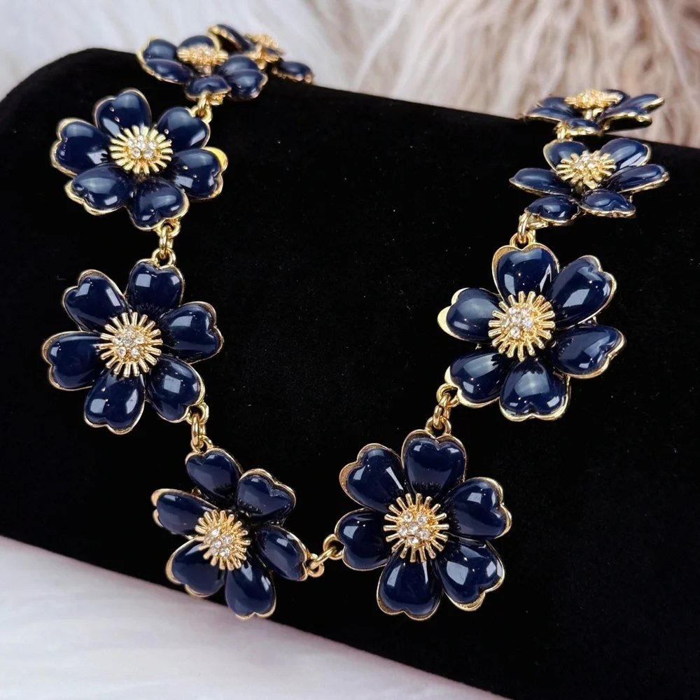 Beautiful, vintage goldtone, blue enamel, clear, bling weighted necklace